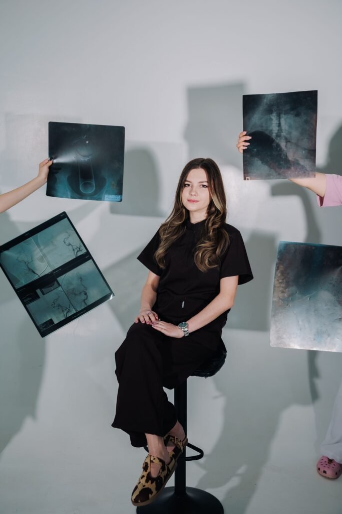 Female doctor posing with X-ray images, representing a long treatment stay that families budget for beyond hospital bills