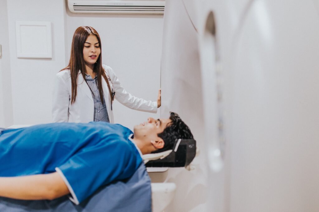 Doctor with patient near an MRI machine