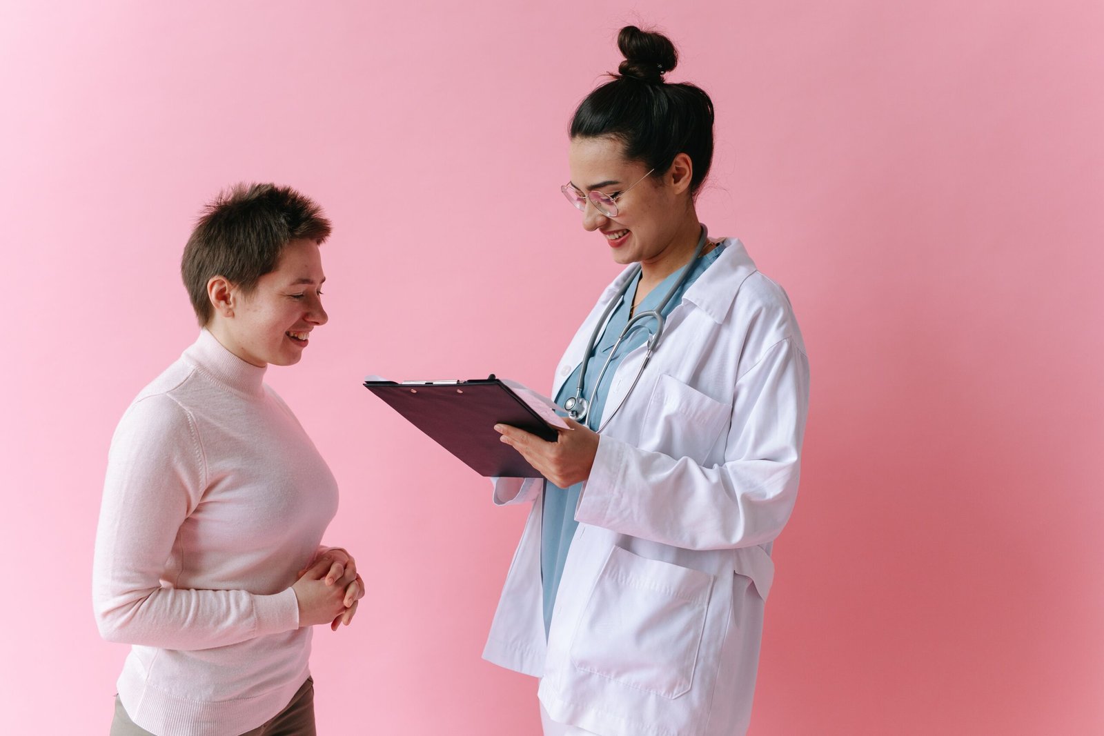 Doctor consulting a smiling patient