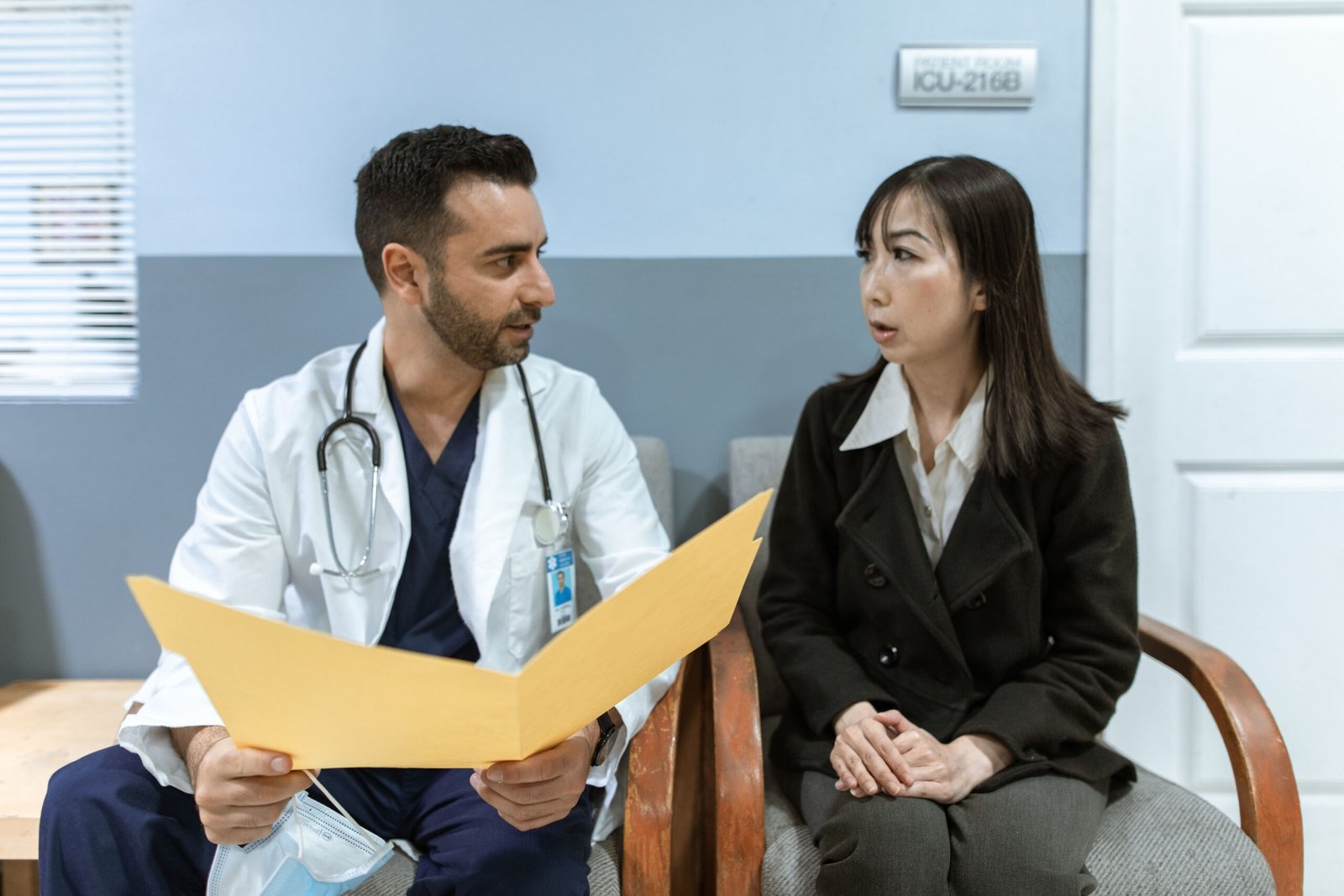 Healthcare professional consulting a patient