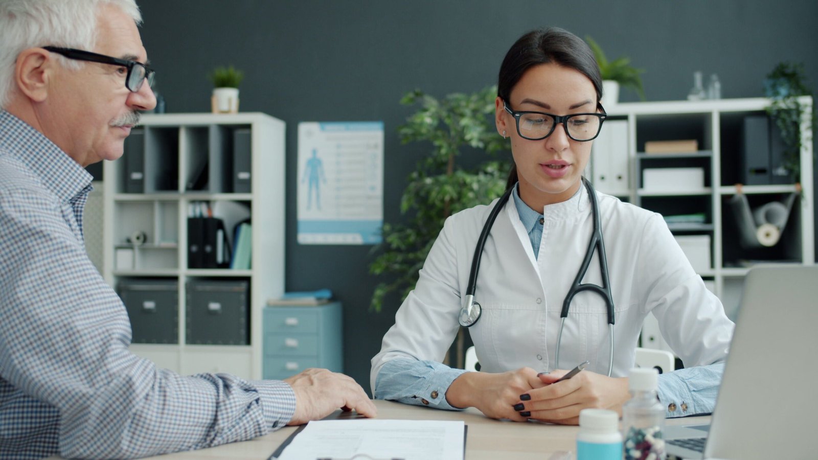 Doctor consulting with an older patient