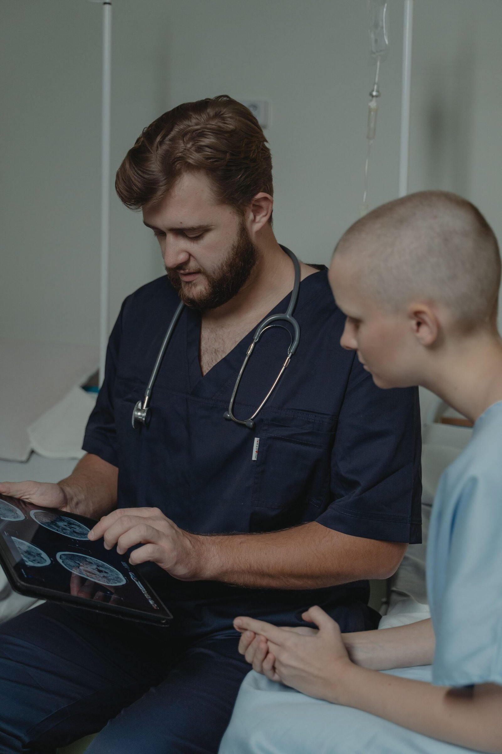 Doctor and patient reviewing results on a tablet