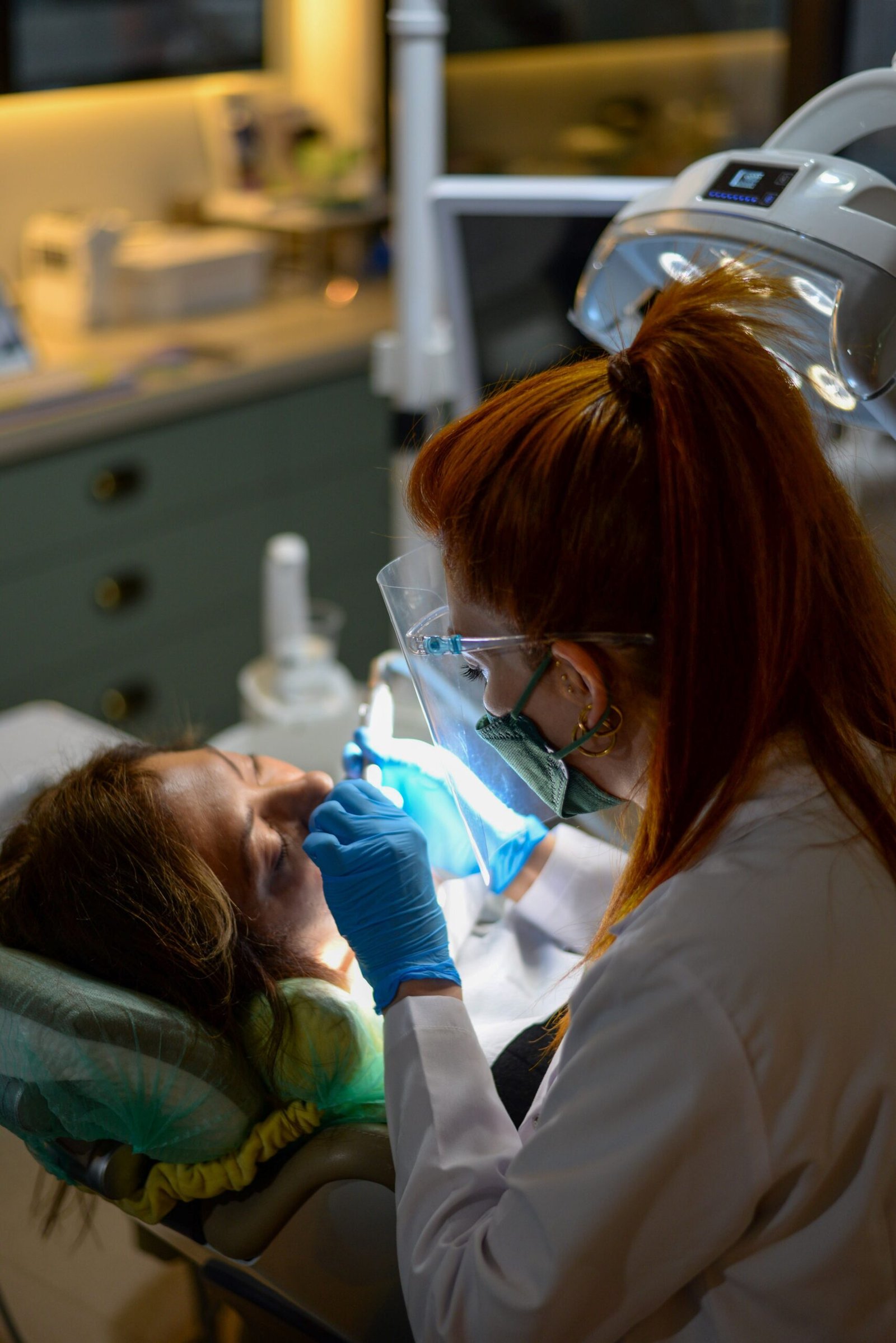 Dentist performing a dental procedure on a patient