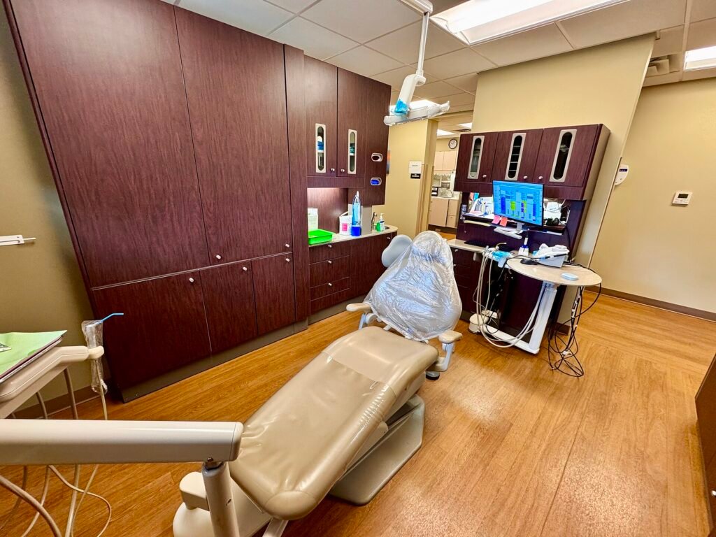 A dental chair in a dentist clinic in North Carolina, United States, a modern dental treatment room