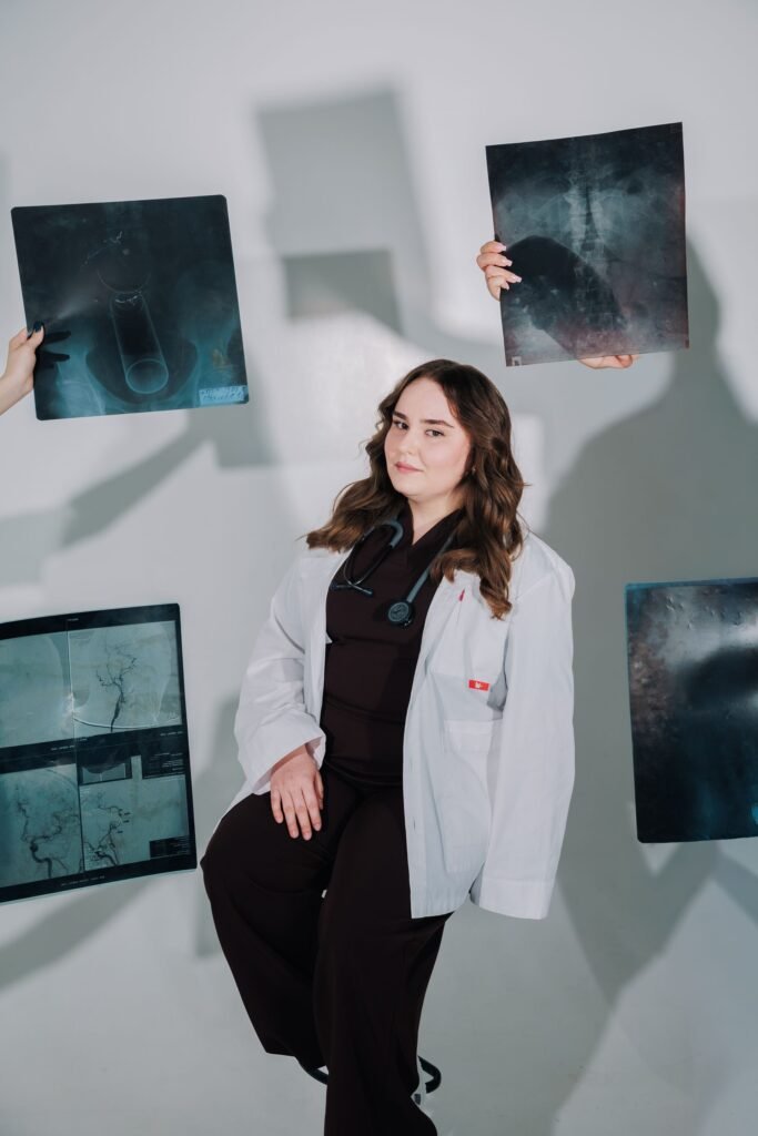 Female doctor analysing medical X-rays, representing treatment supported by government schemes and financial aid