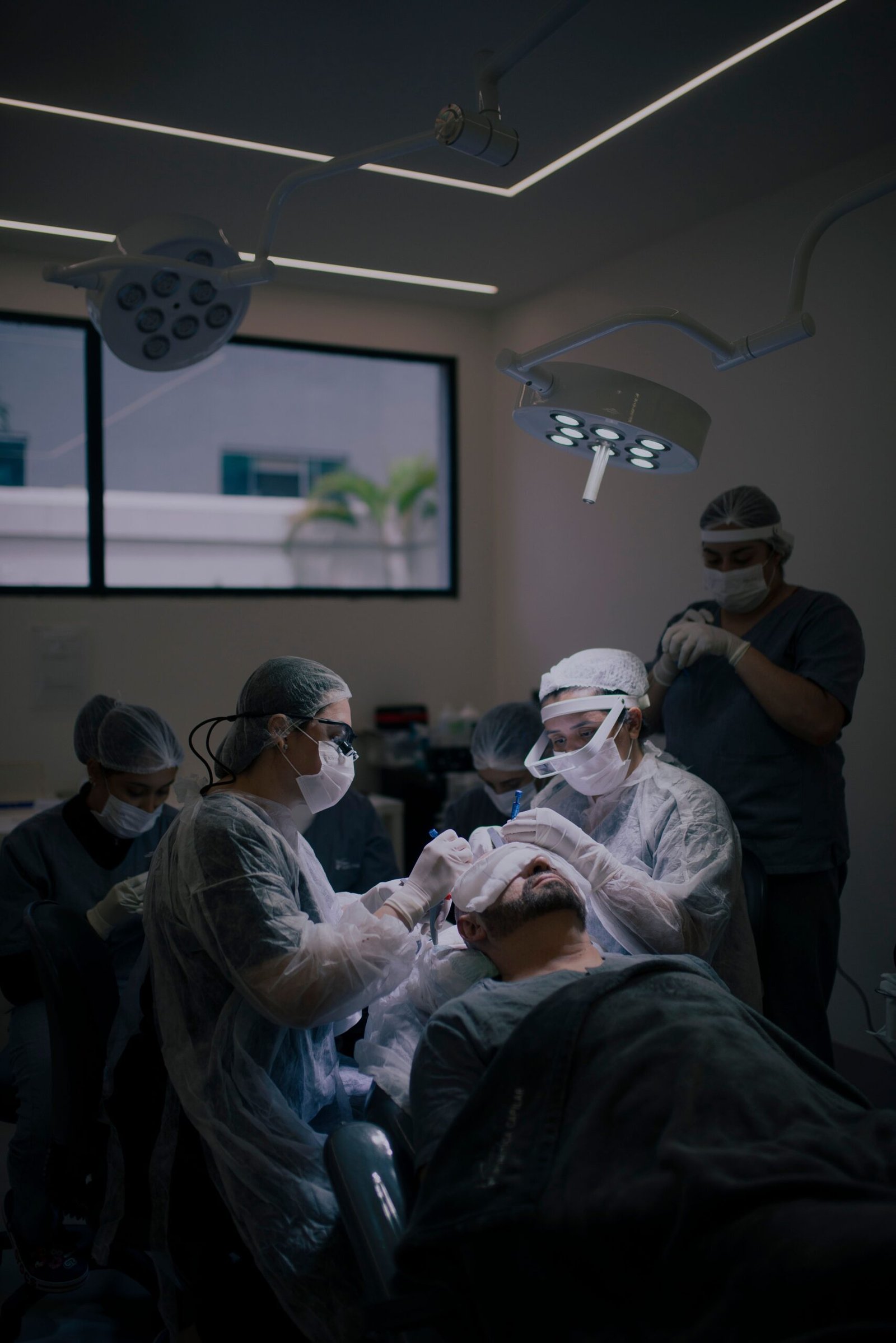 Surgeons conducting a hair transplant procedure
