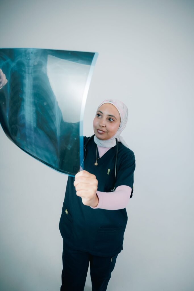 Doctor analysing a chest X-ray image, representing the treatment records families can match against an itemised hospital bill