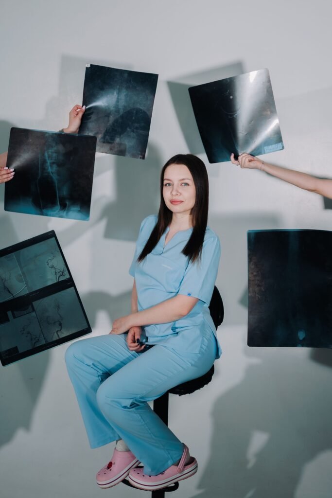 Healthcare worker surrounded by X-ray scans, representing inpatient care in different hospital room categories