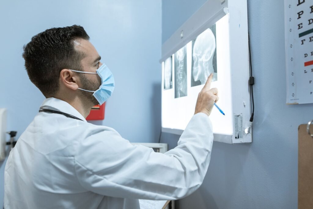 Doctor reviewing results in a clinic, representing a consultation and written treatment plan before travelling to India for treatment