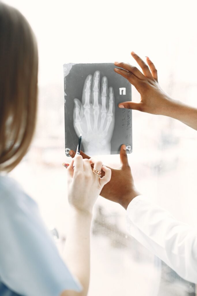 Doctors analysing an X-ray image together in a clinic, representing the consultations and tests a medical concierge helps coordinate in Mumbai