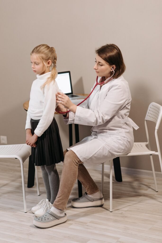 Pediatrician conducting a health checkup on a child