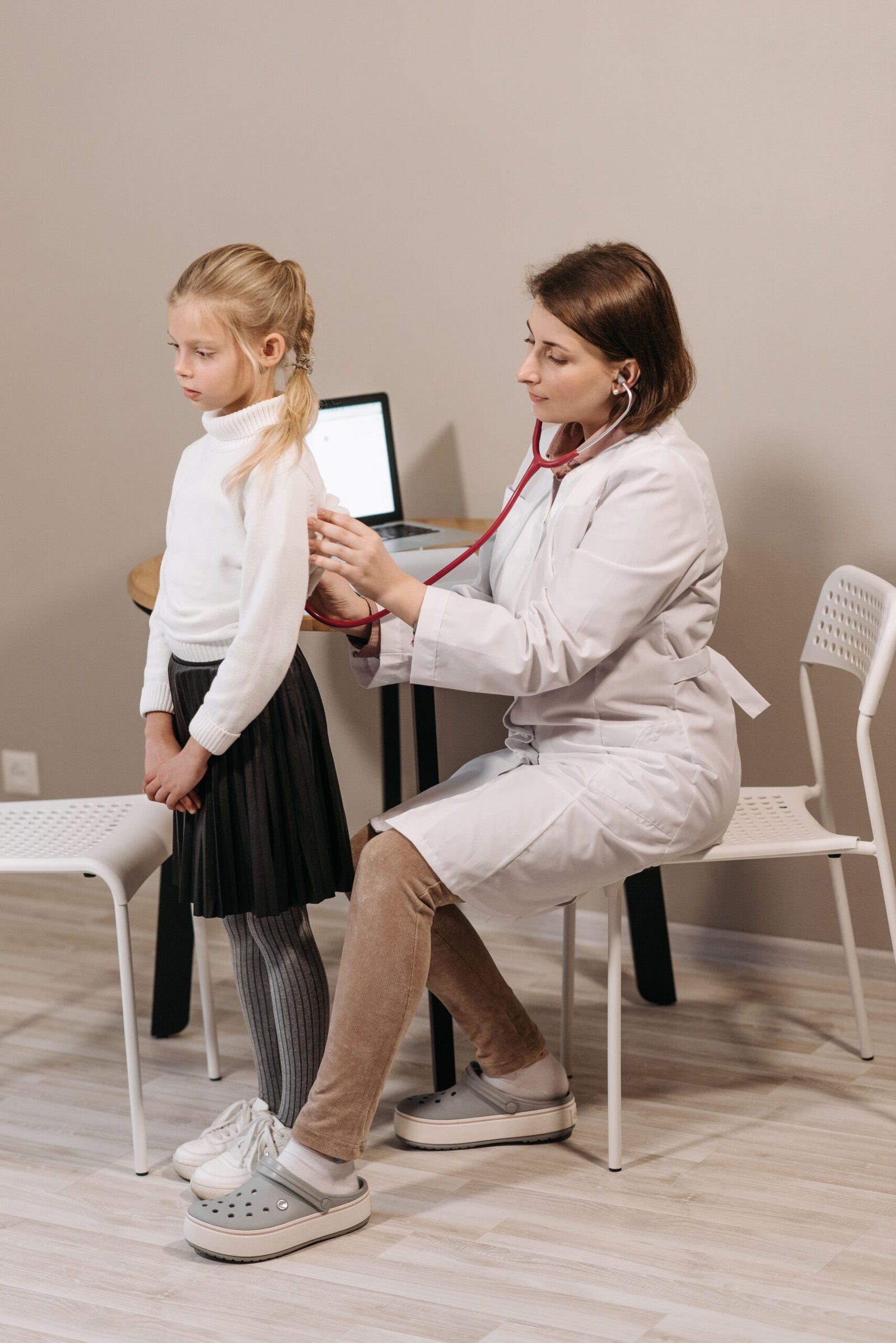 Pediatrician conducting a health checkup on a child