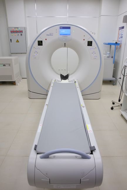 Modern CT scanner room in a hospital showcasing advanced technology