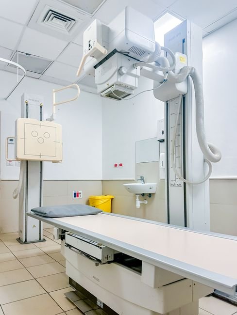 Bright, clean X-ray room in a hospital with advanced imaging equipment