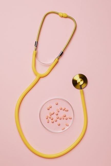 Flat lay of a stethoscope with paperwork and documents