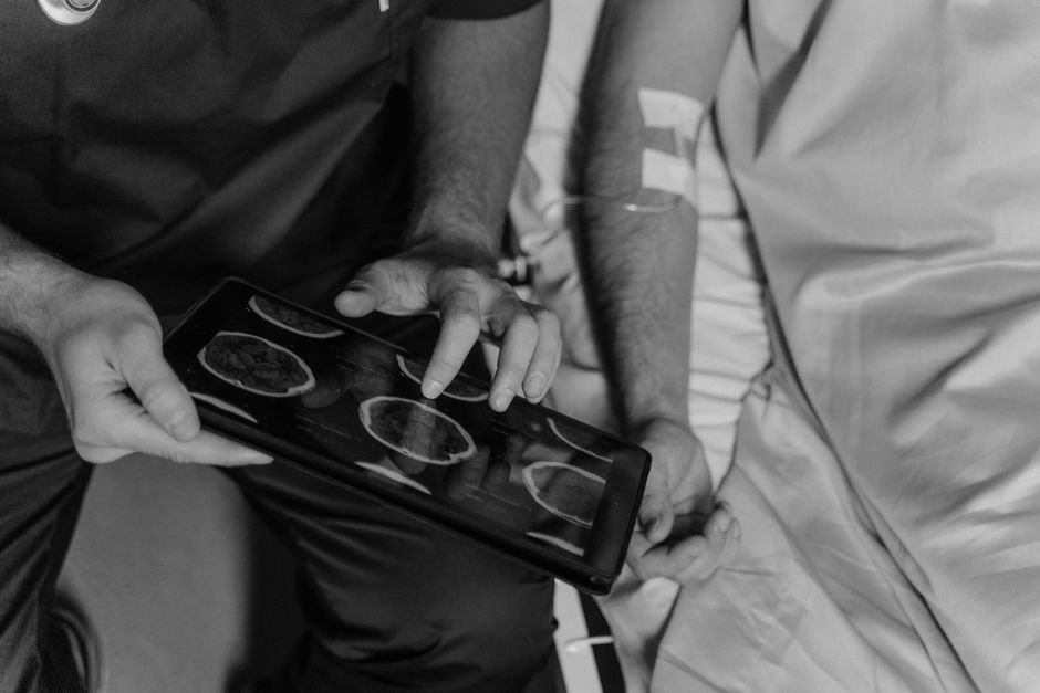 Medical professional reviewing patient documents on a digital tablet