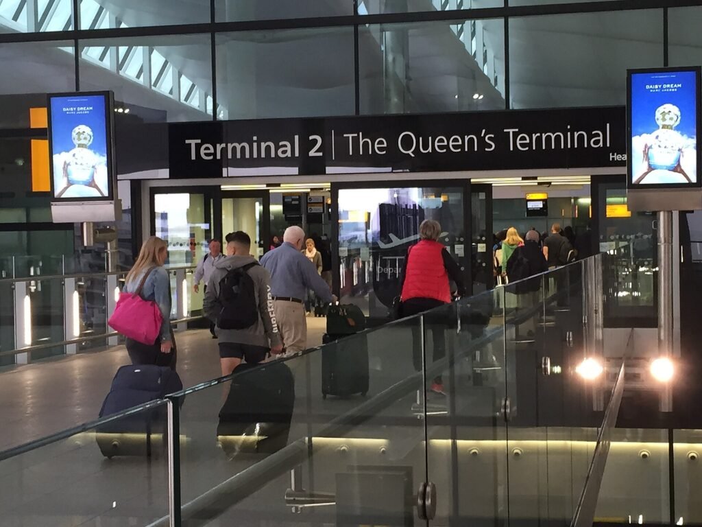 Departure hall entrance, London Heathrow Terminal 2, UK, where many international patients begin their journey