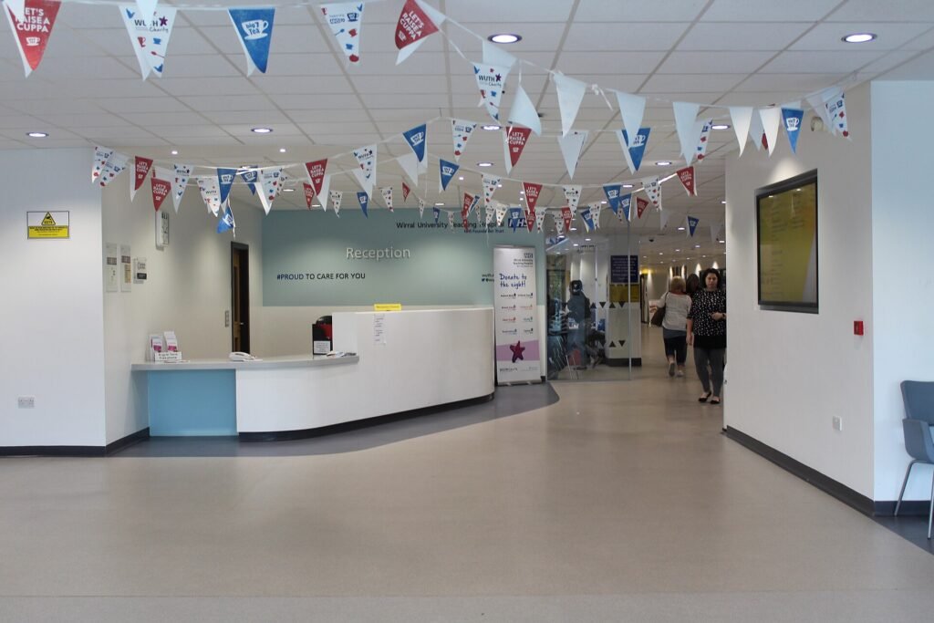 Reception Desk, Arrowe Park Hospital, the kind of hospital desk where patients and facilitators coordinate care