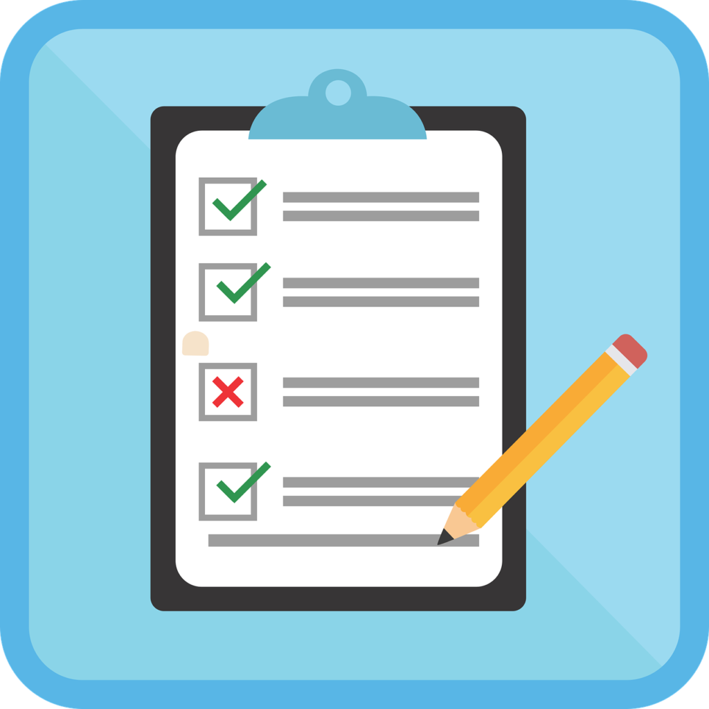 Notebook and pen on a desk, like the questionnaires and rating forms used in an IQ or ADHD assessment