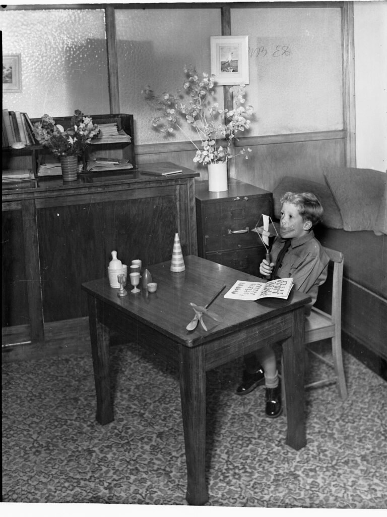 Child working with a therapist during a speech therapy session
